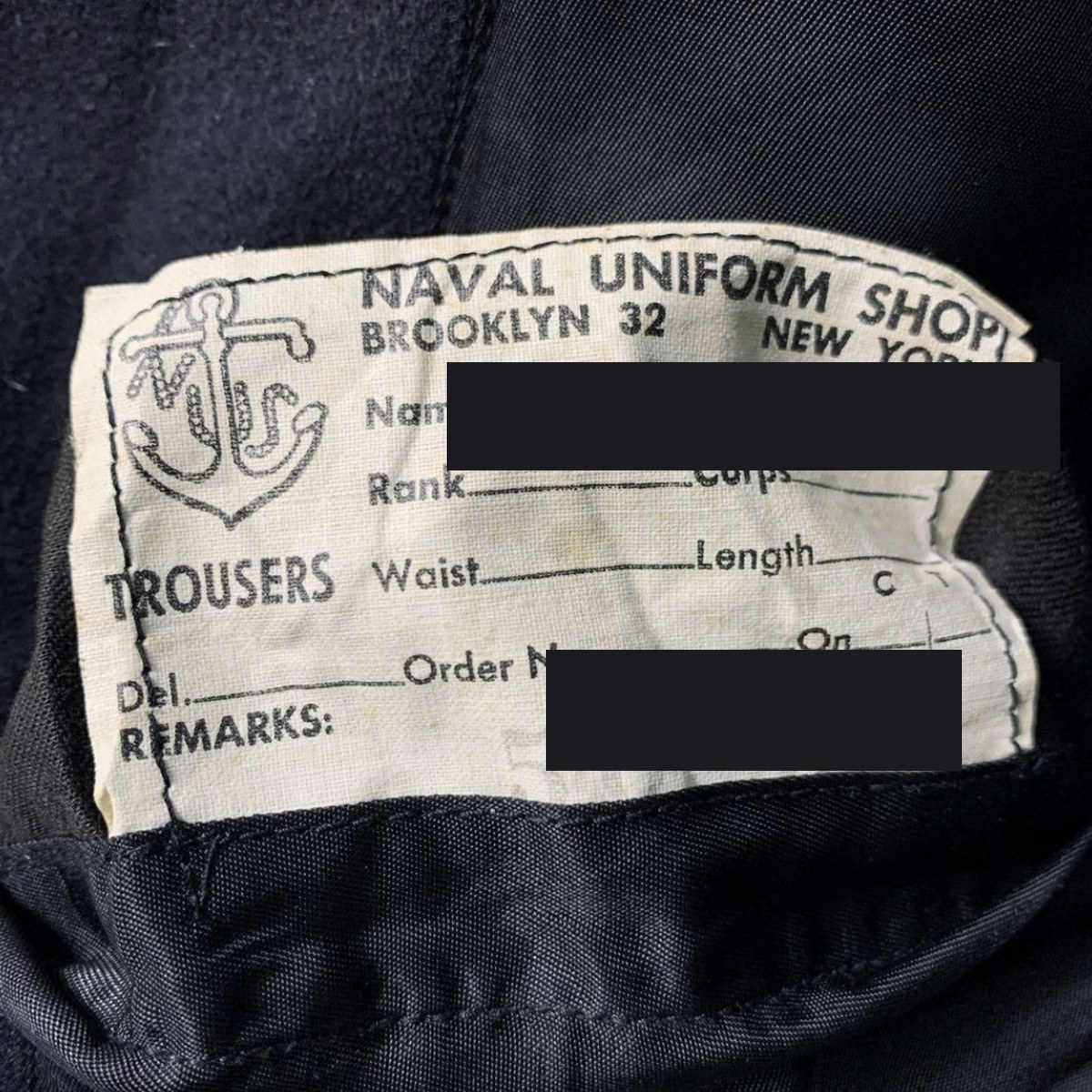 米軍 US NAVY ピーコートの内タグ。NAVAL UNIFORM SHOP ブルックリンの表記